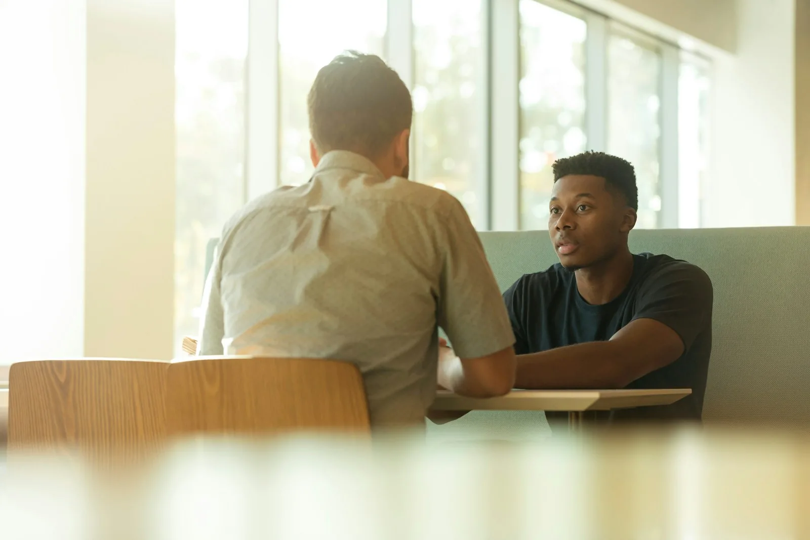Two men talking.