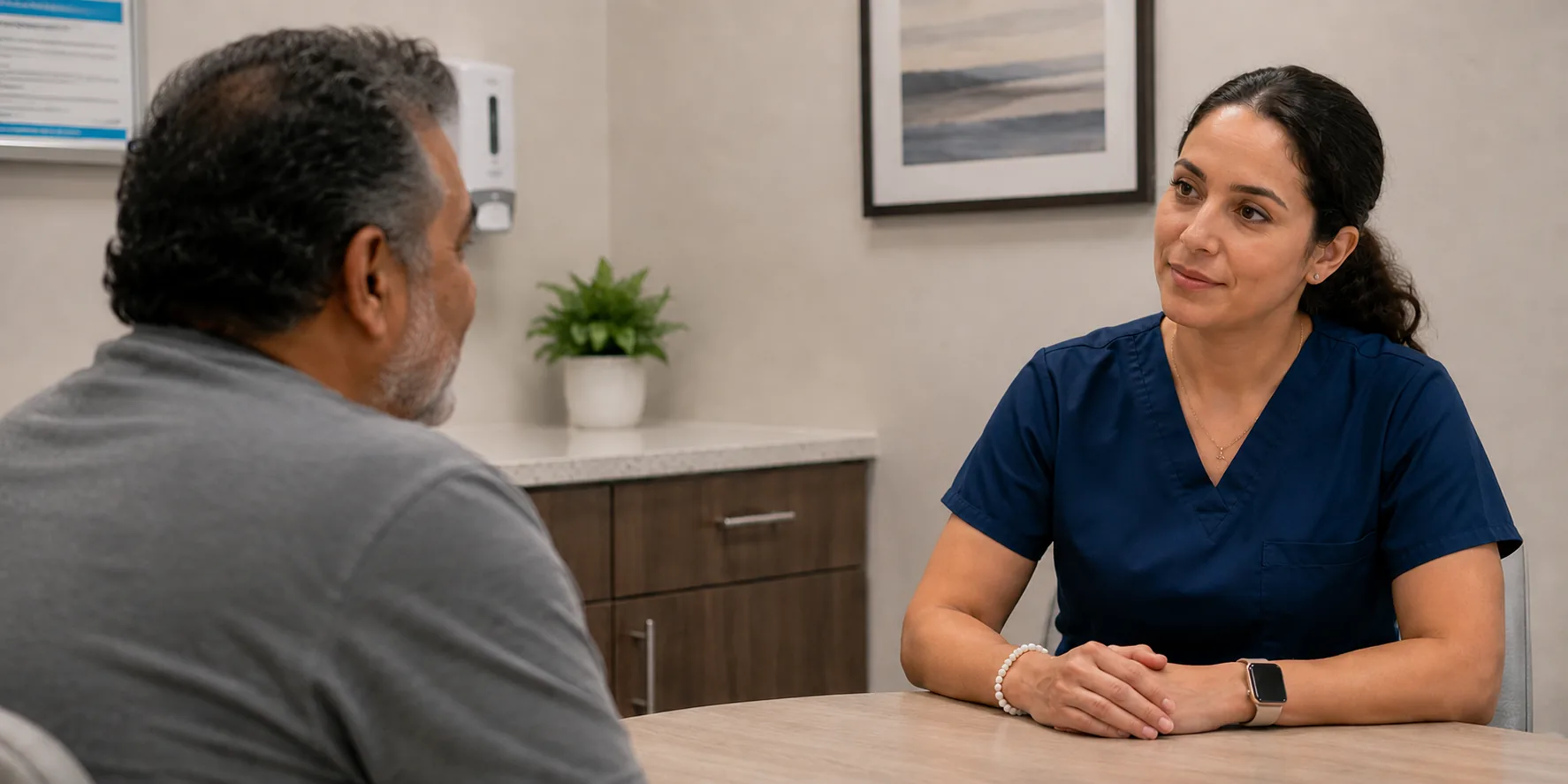 Provider speaking with a patient during a medication-assisted treatment consultation at AriseVida Care.