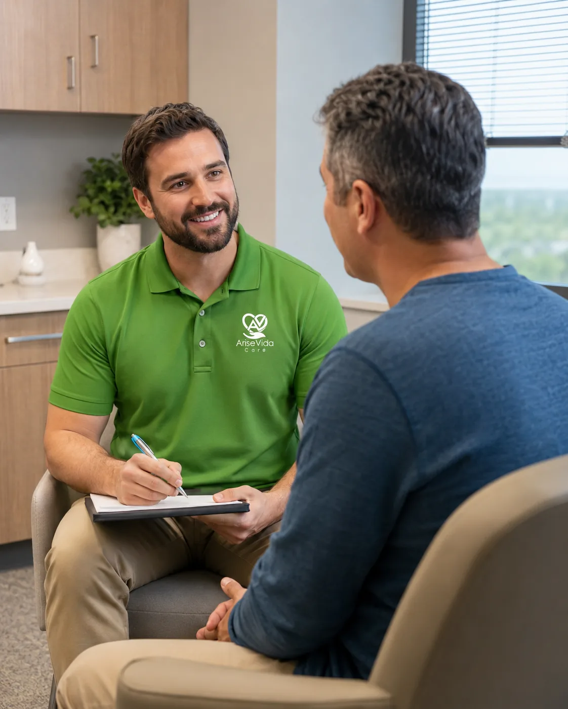 A psychiatric provider and patient meeting in a calm one-on-one consultation at AriseVida Care.